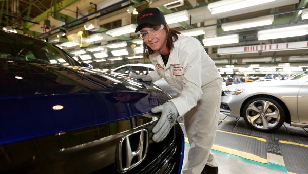 A Honda employee inspects a 2018 Accord sedan at the automaker's assembly plant in Marysville, Ohio.