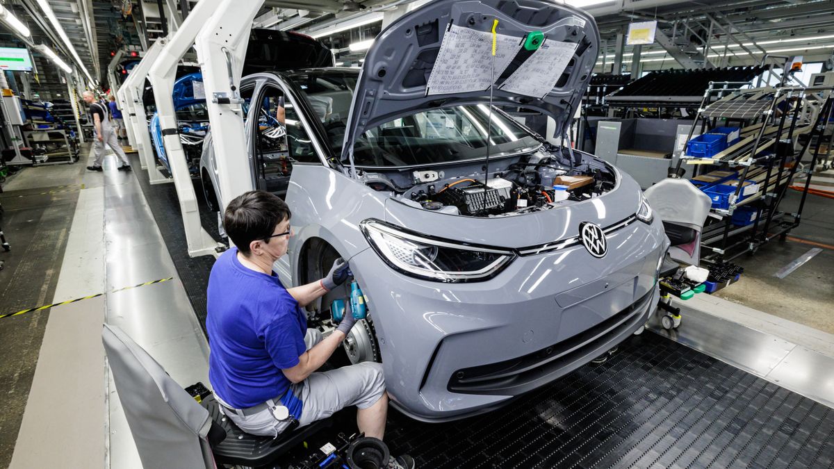 A worker assembles Volkswagen's ID.3 electric car at a factory in Germany.