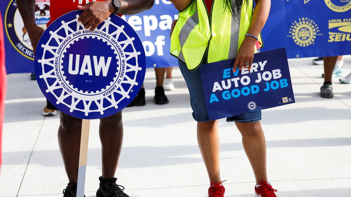 United Auto Workers members rally.