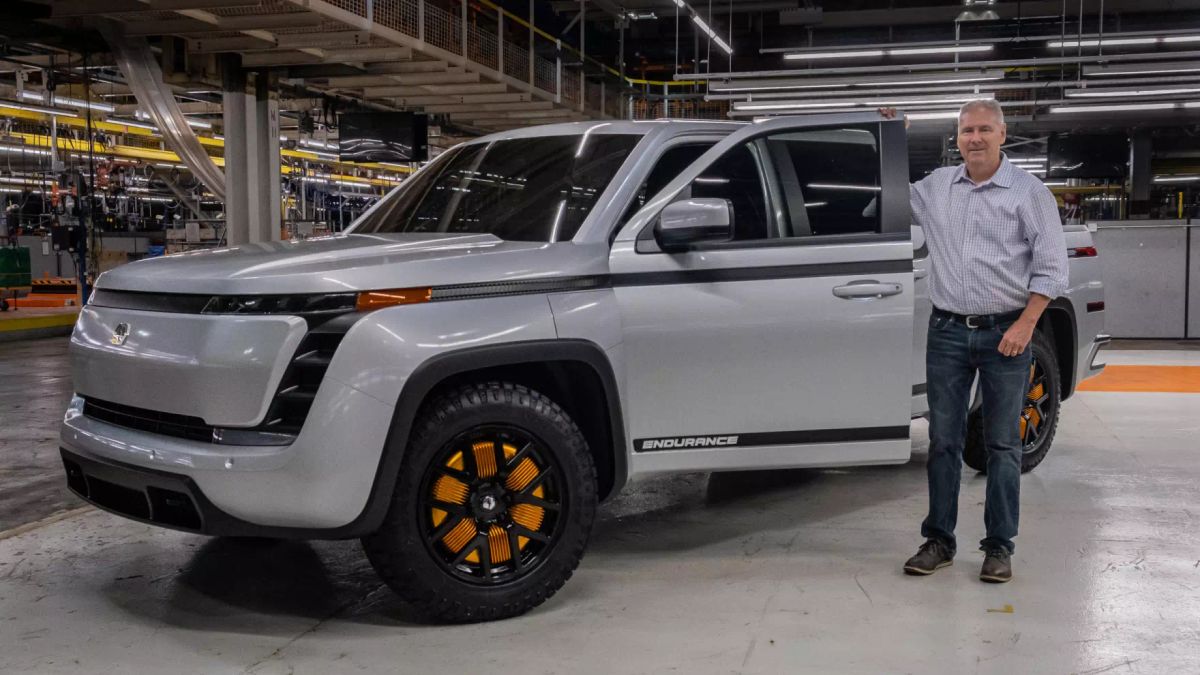 Lordstown Motors CEO Steve Burns standing next to the company's Endurance pickup.